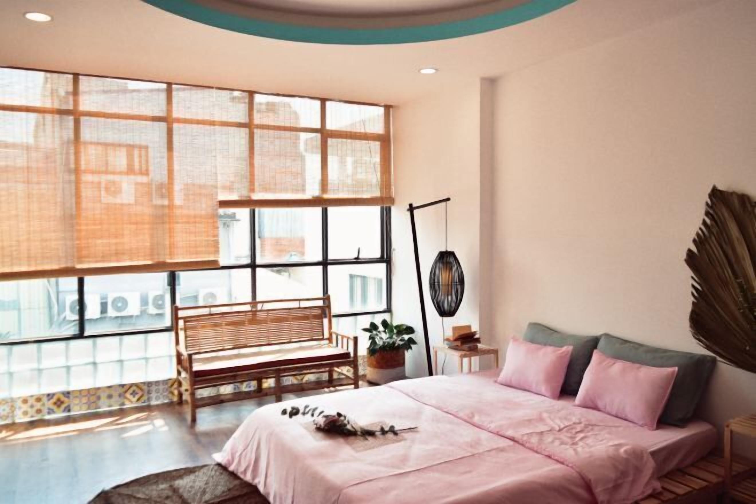 Premium bedding, desk, laptop workspace, blackout curtains