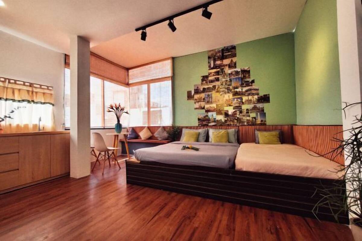 Premium bedding, desk, laptop workspace, blackout drapes