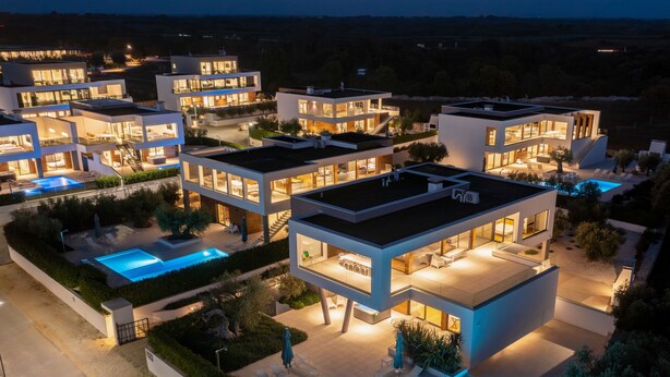 A modern residential complex with multiple connected houses, each featuring a swimming pool and outdoor seating areas. - Old Olive IV by Interhome (Pula/Vodnjan)