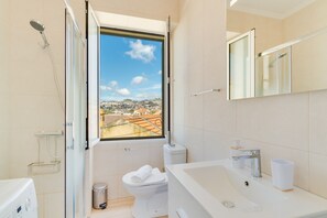 Shower, hair dryer, towels, toilet paper