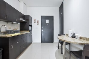 Fridge, microwave, stovetop, coffee/tea maker