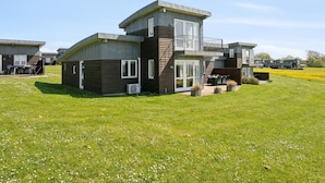 A modern multi-story residential building with a flat roof, large windows, and a balcony. - "Halvor" - 275m from the sea by Interhome (Faaborg)
