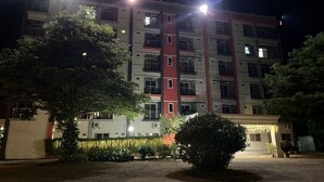 A multi-story building with a sign reading "PILATUS" at the top. - Pilatus Apartment (Mueang Loei)