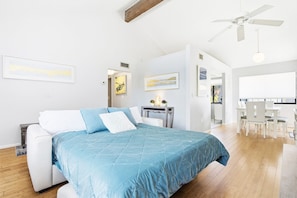A modern bedroom with a large bed, a desk, and a dining area. - Beach Rd, 300ft to Beach Access & 500ft to Siesta Key Village, 2bdr (Siesta Key)