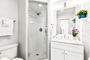 Shower, eco-friendly toiletries, hair dryer, towels