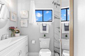 Shower, eco-friendly toiletries, hair dryer, towels