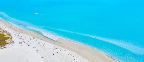 On the beach, sun-loungers, beach towels