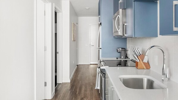 Fridge, dining tables - Landing | Incredible 1BD, Rooftop Lounge, Gym (Nashville)