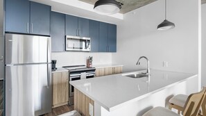 Fridge, dining tables - Landing | Spectacular 1BD, Rooftop Lounge (Nashville)