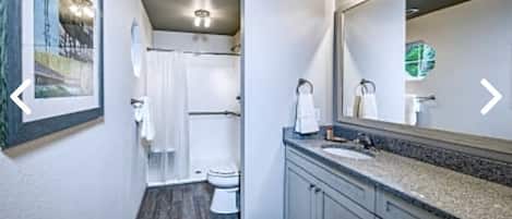 Shower, hair dryer, towels, toilet paper