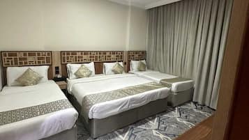 Standard Quadruple Room | Iron/ironing board, free WiFi