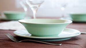A table with a green bowl and a fork on a brown tablecloth. - 2 bedrooms apartment Anita with BBQ (Pula)