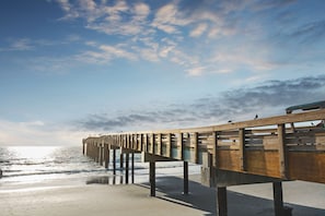 Walk along the pier and enjoy the serene atmosphere.