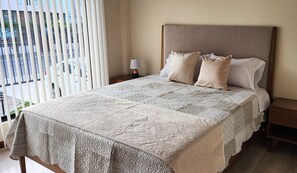 Down duvets, desk, laptop workspace, blackout curtains