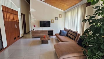 Family Apartment | Living area | 50-inch Smart TV with digital channels, Netflix, streaming services