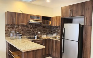 Full-size fridge, microwave, stovetop, rice cooker