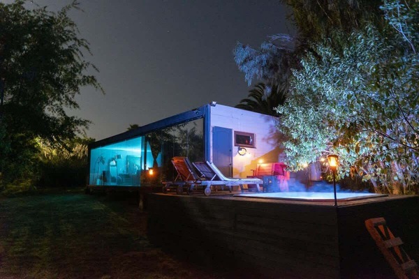 Jacuzzi glowing at night for a soothing soak under the stars