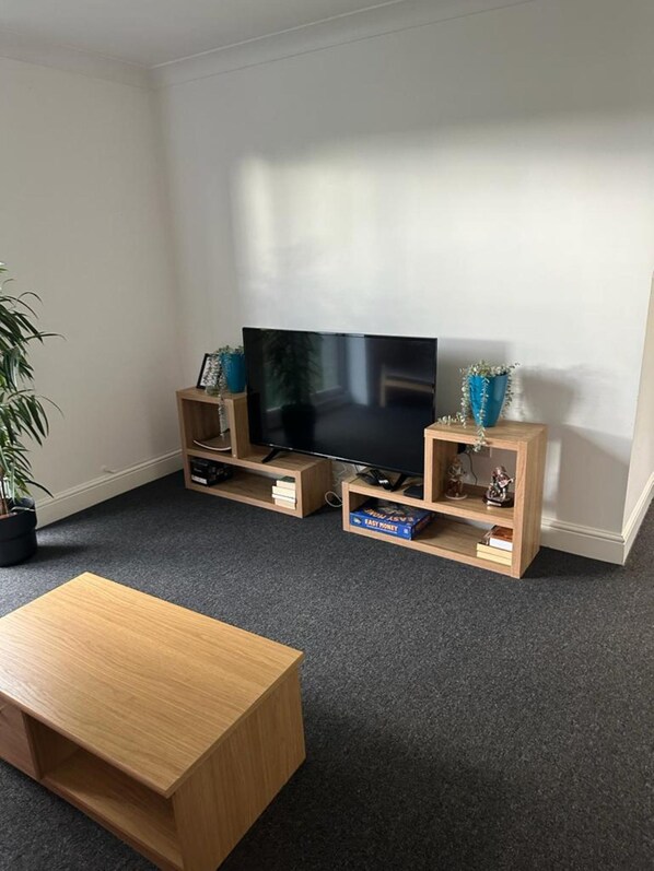 Business Apartment | Living area | 55-inch Smart TV with digital channels, Netflix, streaming services