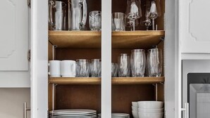 A kitchen with white cabinets, a wooden countertop, a toaster, a coffee maker, and a stove. - Inviting Retreat: Spacious 2 BR 1.5 Bath Townhouse (Hopewell)