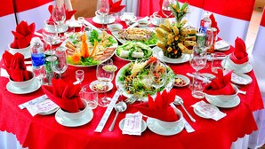 A table set for a meal with various dishes, glasses, and utensils. - Song Huong Hue Hotel (Hue)