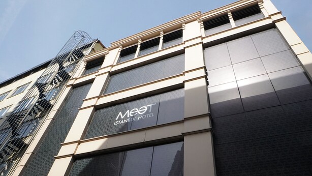 A modern building with a sign reading "Meet Istanbul Hotel". - MEET ISTANBUL (Istanbul)