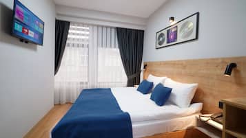 Standaard kamer | Een minibar, een kluis op de kamer, geluiddichte muren, gratis wifi