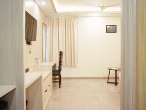 Habitación ejecutiva | Ropa de cama de alta calidad y edredones de plumas