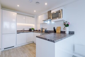 Apartment | Private kitchen | Fridge, microwave, oven, stovetop