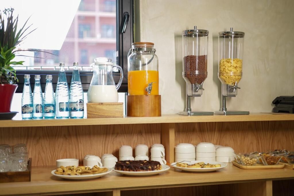 A breakfast buffet with various food items and beverages.