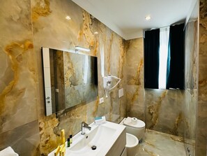 Superior Triple Room | Bathroom | Shower, rainfall showerhead, hair dryer, bathrobes