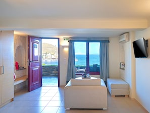 Deluxe Triple Room, Sea View | Living area | Flat-screen TV