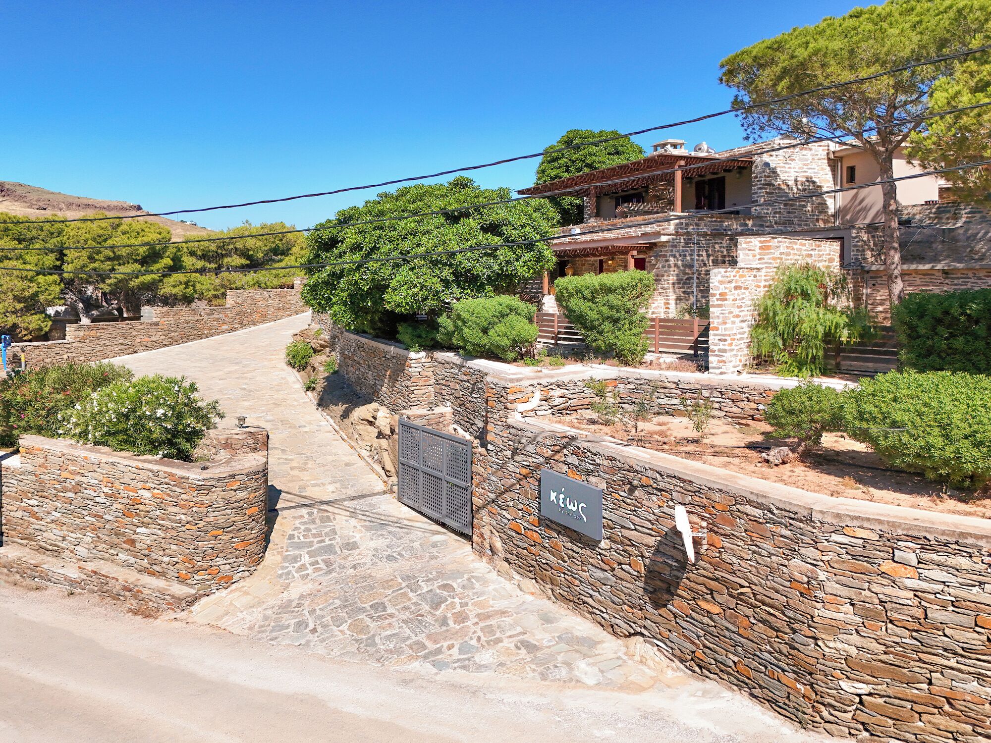 A stone-walled building with a sign reading 'REWC.'