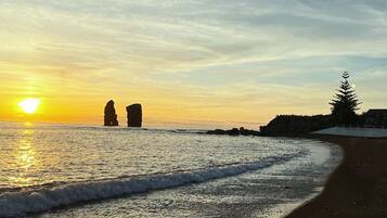 Beach nearby, black sand, beach umbrellas, 2 beach bars