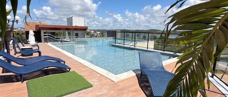 Outdoor pool, open 9:00 AM to 10:00 PM, pool umbrellas, sun loungers