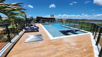 Outdoor pool, open 9:00 AM to 10:00 PM, pool umbrellas, sun loungers