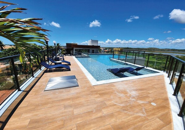 Outdoor pool, open 9:00 AM to 10:00 PM, pool umbrellas, sun loungers
