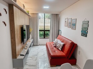 Deluxe Apartment | Living area | 50-inch Smart TV with digital channels