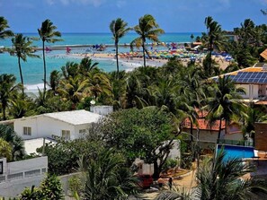 On the beach, white sand, free beach cabanas, sun-loungers