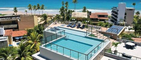 Outdoor pool, open 9:00 AM to 10:00 PM, pool umbrellas, pool loungers