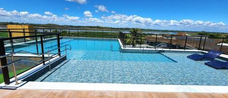 Outdoor pool, open 9:00 AM to 10:00 PM, pool umbrellas, sun loungers