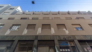 A multi-story building with a sign for 'INTERMEDIA' on the ground floor. - Leia Hospitality (Milan)