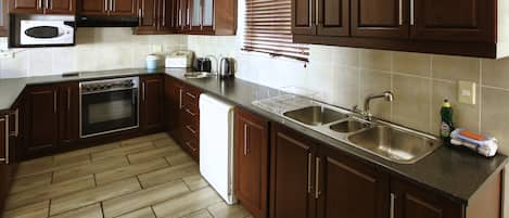 Traditional House | Private kitchen | Full-size fridge, microwave, oven, stovetop