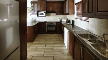 Traditional House | Private kitchen | Full-size fridge, microwave, oven, stovetop