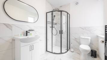 Shower, hair dryer, towels, soap