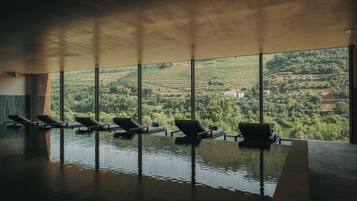 Indoor pool, outdoor pool, pool umbrellas, pool loungers