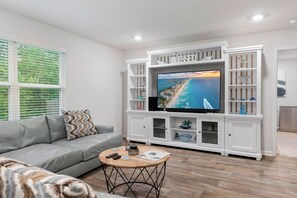 Smart TV, fireplace, books, stereo