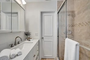 Shower, hair dryer, towels, soap