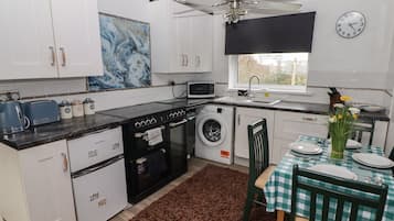 Fridge, electric kettle, toaster, cookware/dishes/utensils