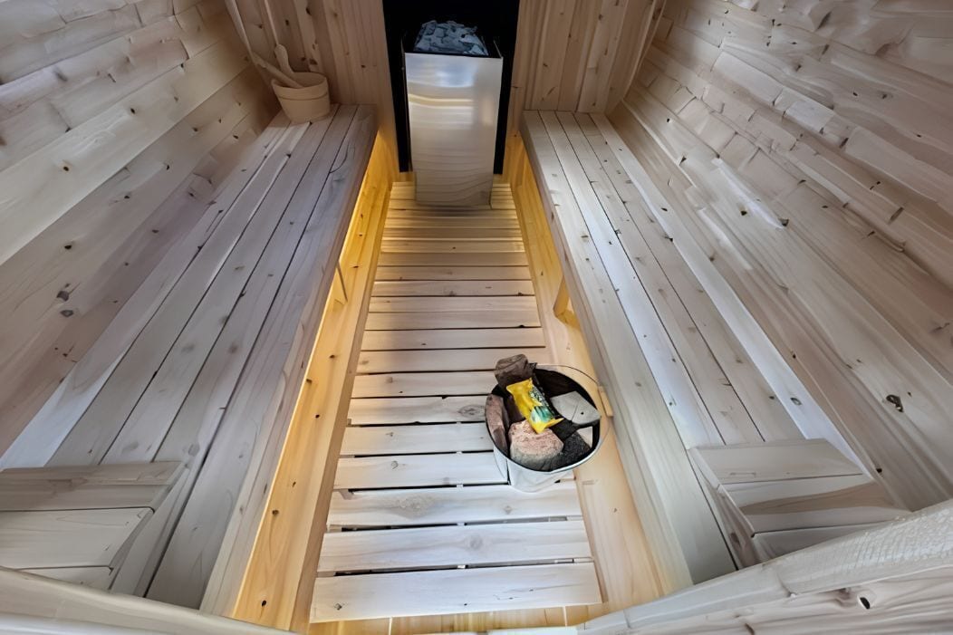 A sauna with wooden walls and a bench.