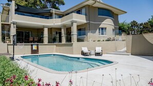 A modern two-story house with a swimming pool, outdoor seating, and a covered patio area. - Anchors at Mollymook Beach (Mollymook)